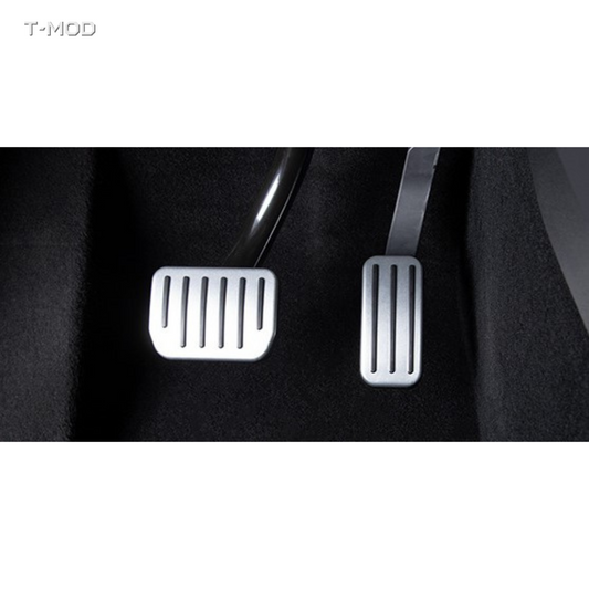Original silver accelerator and brake pedal covers installed in a Tesla
