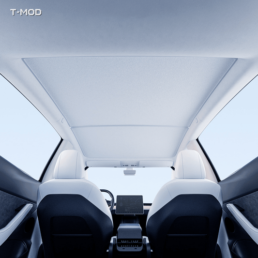 Beige two-piece graphene honeycomb roof sunshade installed in a Tesla Model Y Juniper