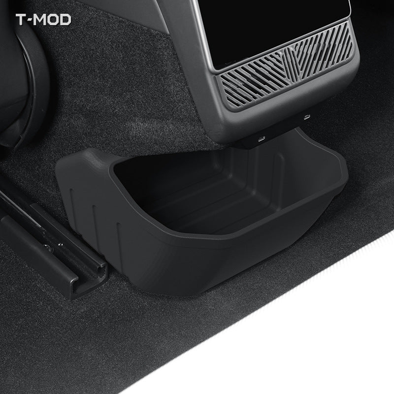 Black silicone rear-floor storage box installed beneath the rear console of Tesla Model 3 Highland