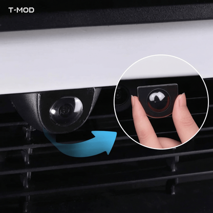 Installation view of a black front camera lens protector for Tesla Model 3 Highland, Model Y Juniper, Model YL and Model Y Standard