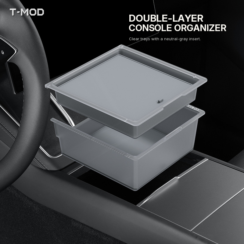 Clear double-layer center-console organizer with a smooth neutral-gray insert, shown above the console area.