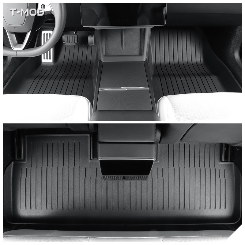 Black floor mats installed in a Tesla Model 3 Highland cabin