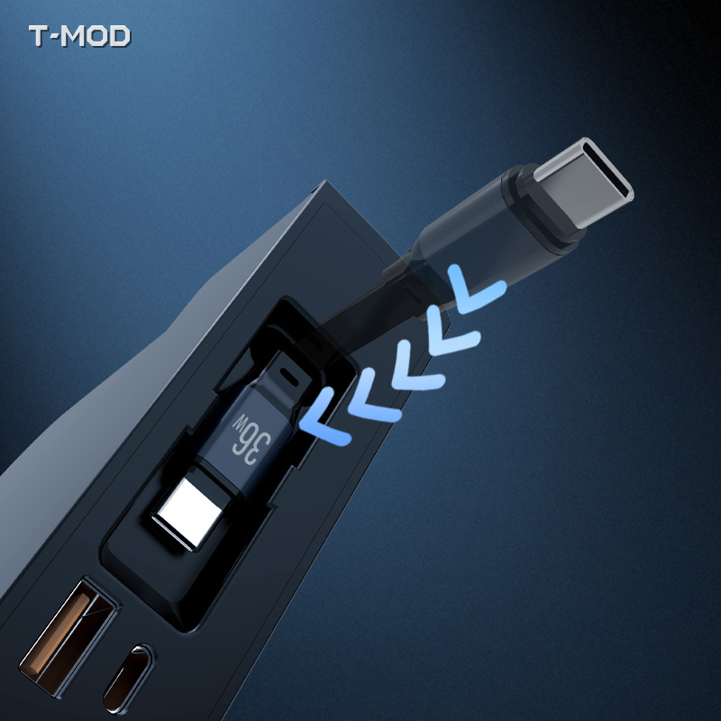 Hidden center-console charging hub retractable USB-C cable detail