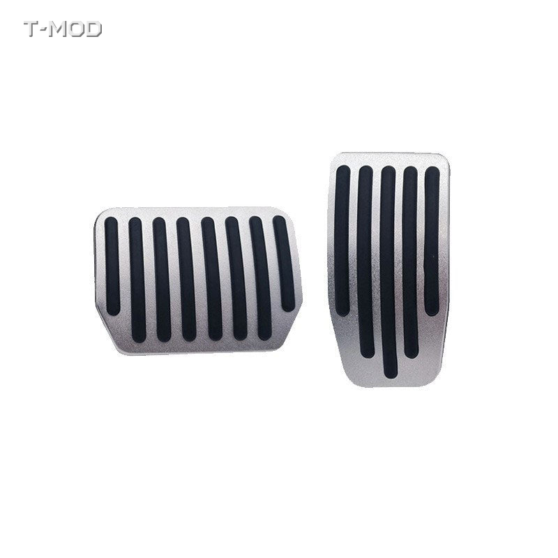Original silver accelerator and brake pedal covers with straight black ridges