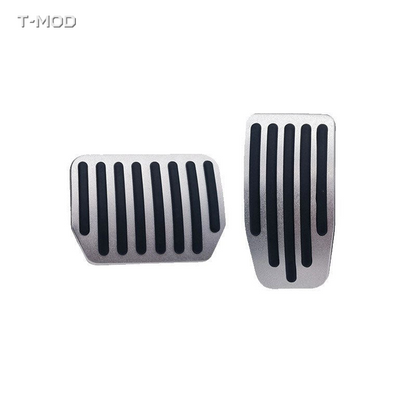Original silver accelerator and brake pedal covers with straight black ridges