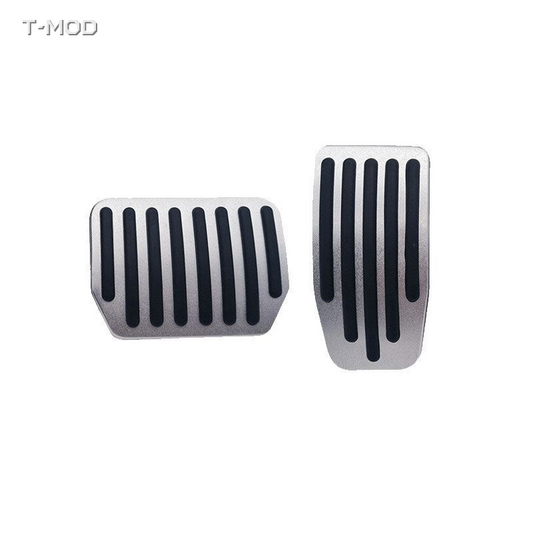 Original silver accelerator and brake pedal covers with straight black ridges